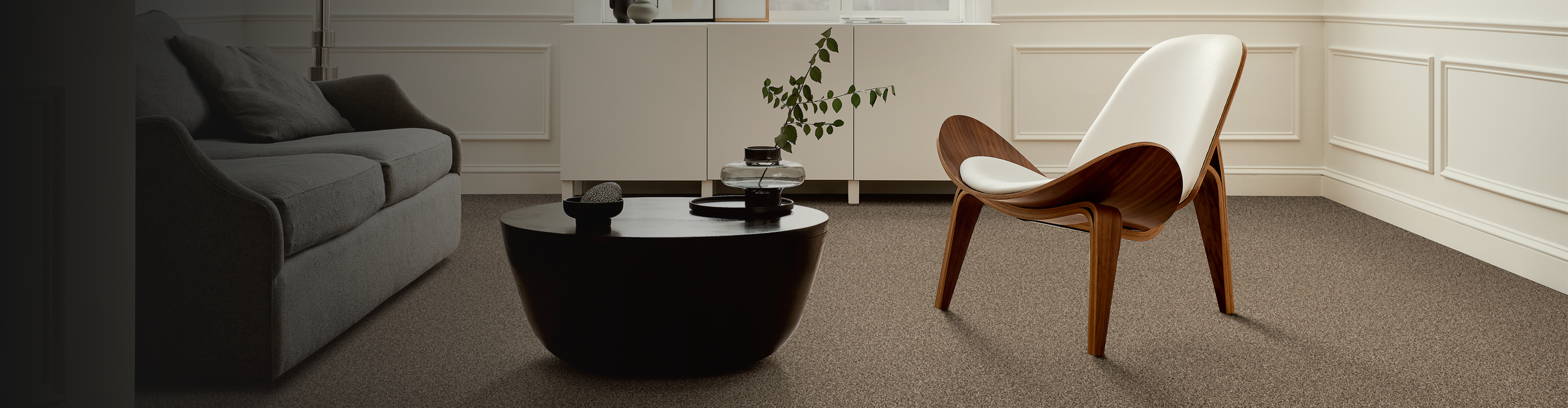 brown carpet in a living room with modern accent chair
