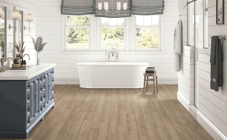 luxury vinyl plank flooring in bathroom with blue-gray roman shades